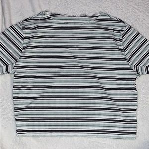 A black, green, and white striped shirt